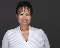 Headshot of woman in white sweater
